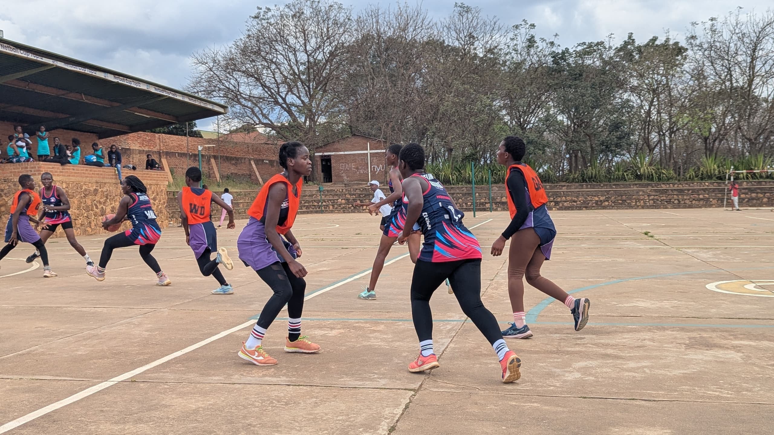 Kalulu Queens team huddle during training